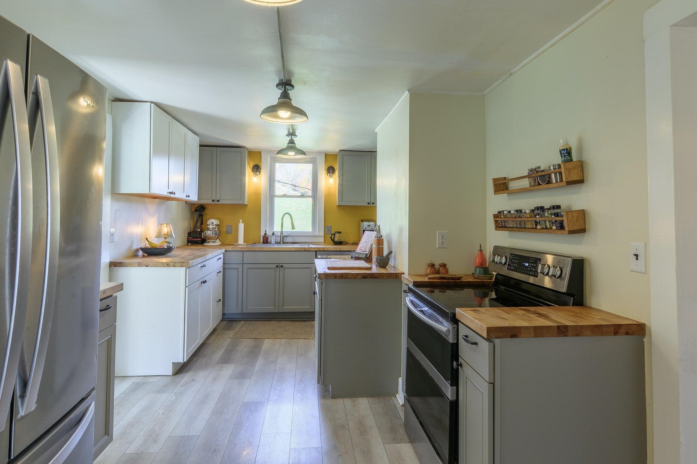 75 Margarets Lane Lexington, VA 24450 - Photo 22 of 55 a kitchen with a sink stove and cabinets