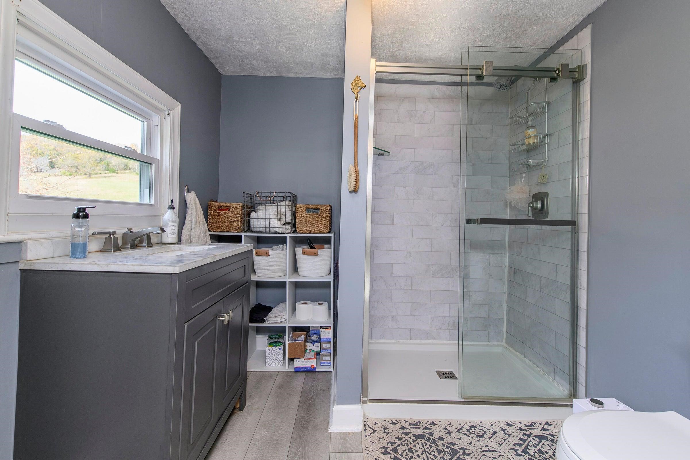 75 Margarets Lane Lexington, VA 24450 - Photo 30 of 55 a bathroom with a tub sink shower and mirror