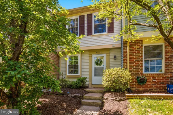 a front view of a house having yard