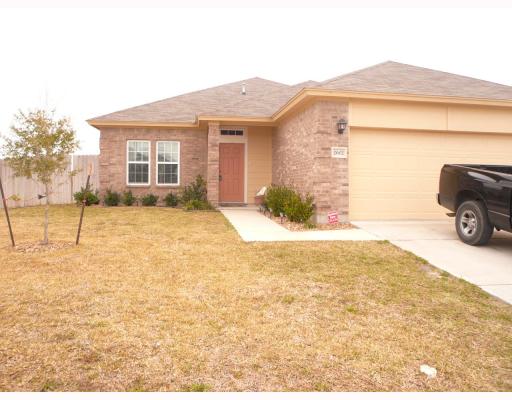 a view of a car parked in front of a house