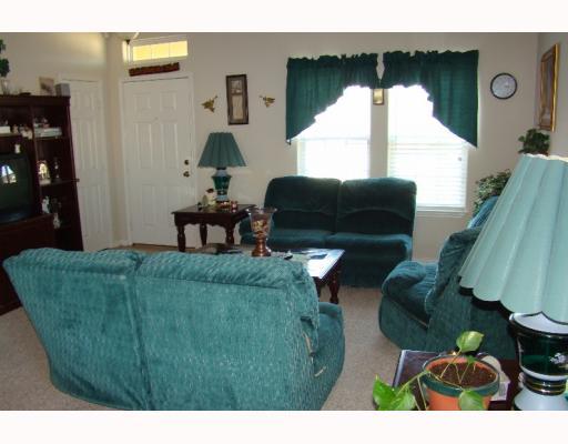 2602 Whirlwind Street Corpus Christi, TX 78414 - Photo 2 of 7 a living room with furniture and a large window