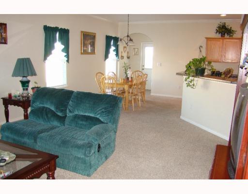 2602 Whirlwind Street Corpus Christi, TX 78414 - Photo 7 of 7 a living room with furniture and a chandelier