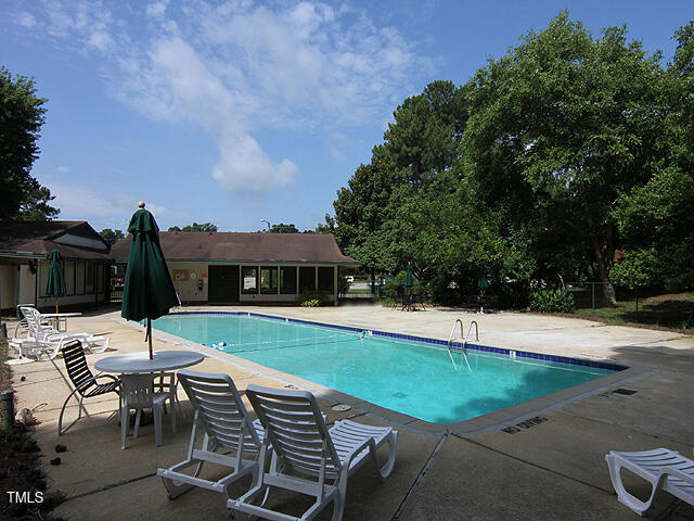 5804 Falls Of Neuse Road, Unit D Raleigh, NC 27609 - Photo 18 of 18 an outdoor space with swimming pool and furniture