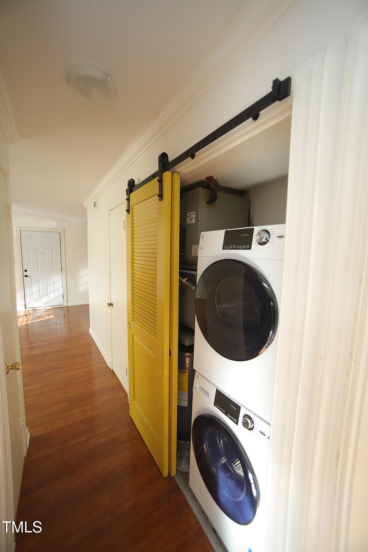 5804 Falls Of Neuse Road, Unit D Raleigh, NC 27609 - Photo 9 of 18 a view of a hallway with washer and dryer
