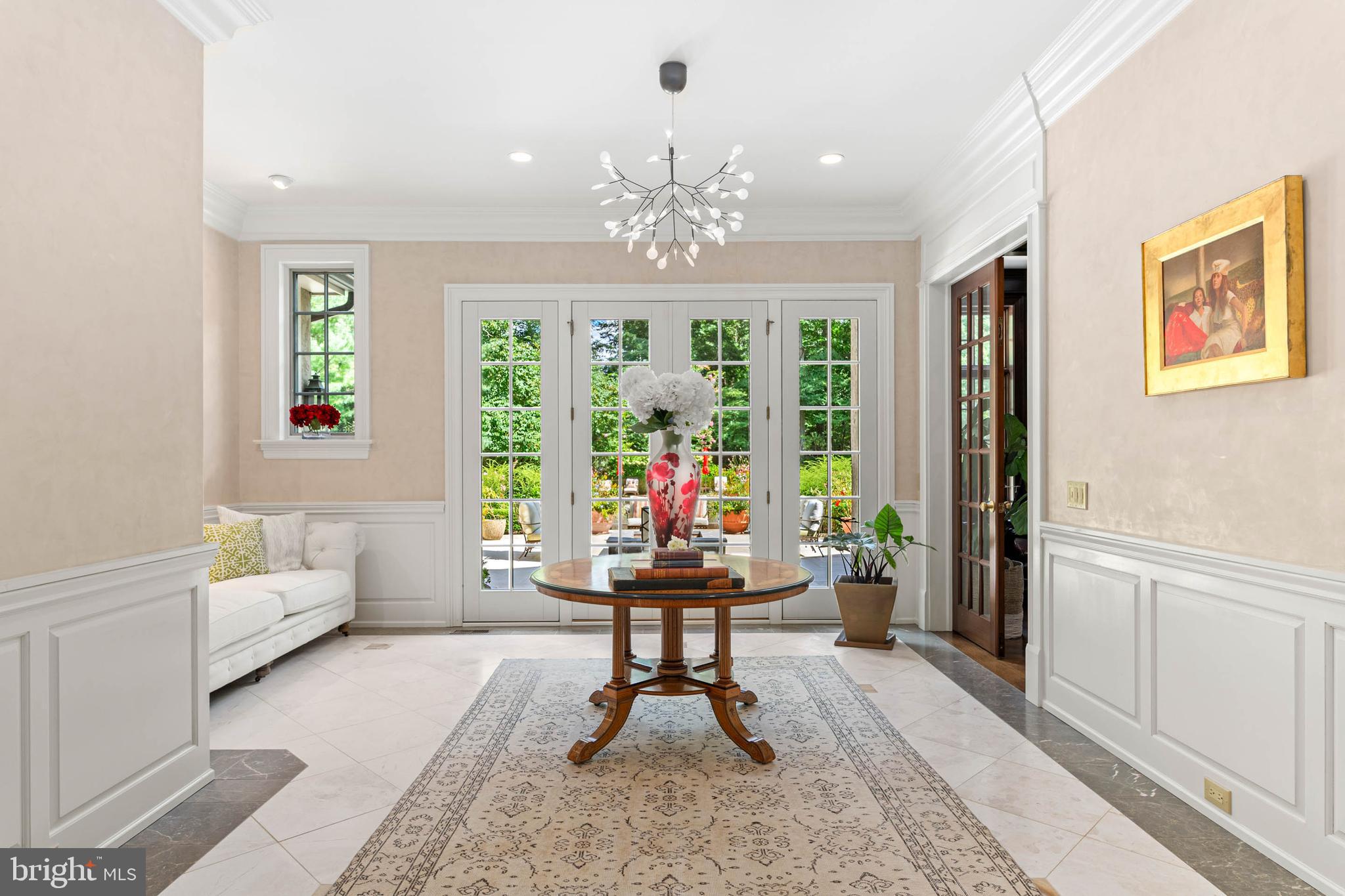 545 Avonwood Road Haverford, PA 19041 - Photo 11 of 86 a living room with furniture and a chandelier