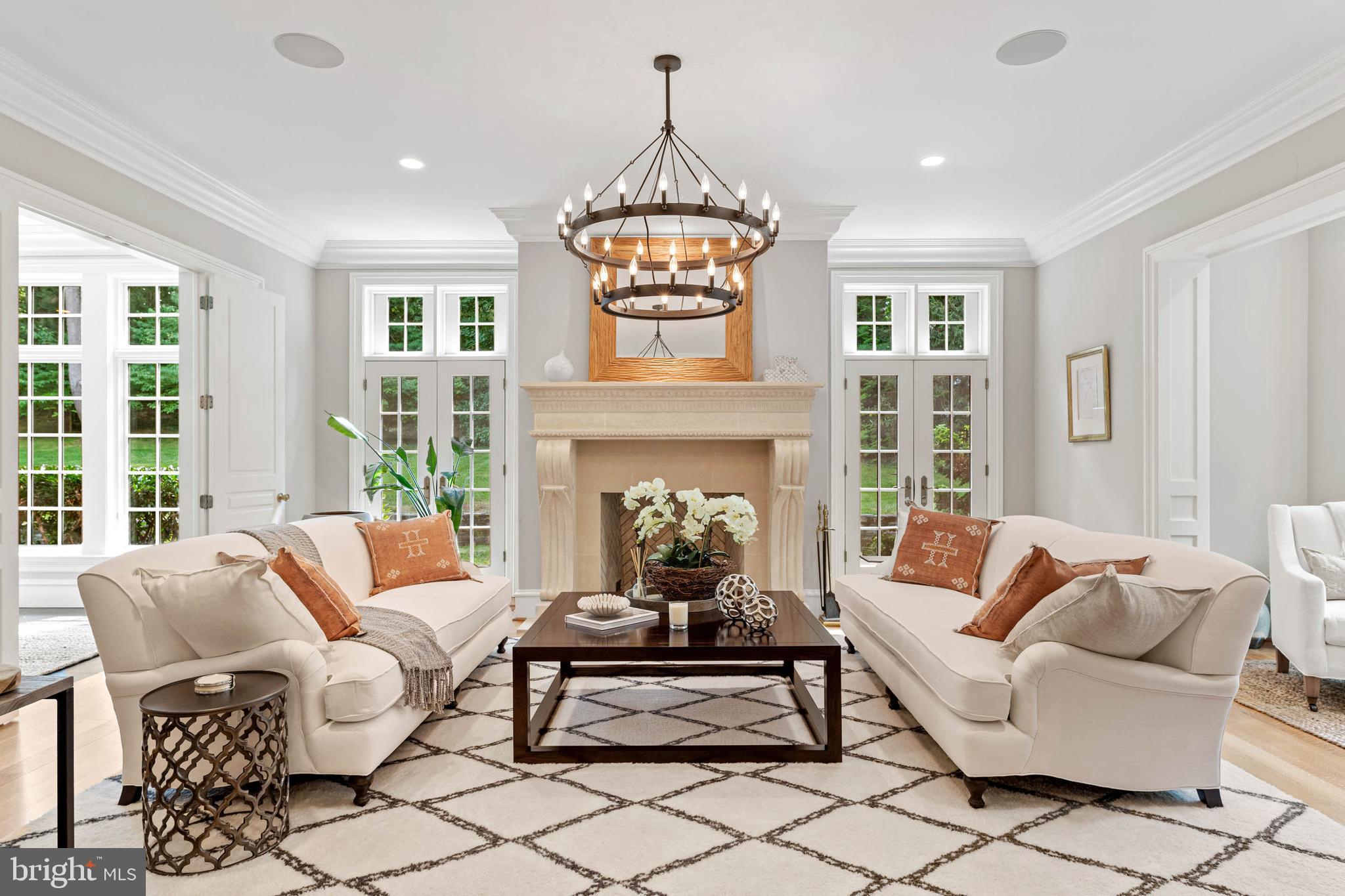 545 Avonwood Road Haverford, PA 19041 - Photo 14 of 86 a living room with furniture a fireplace and a chandelier