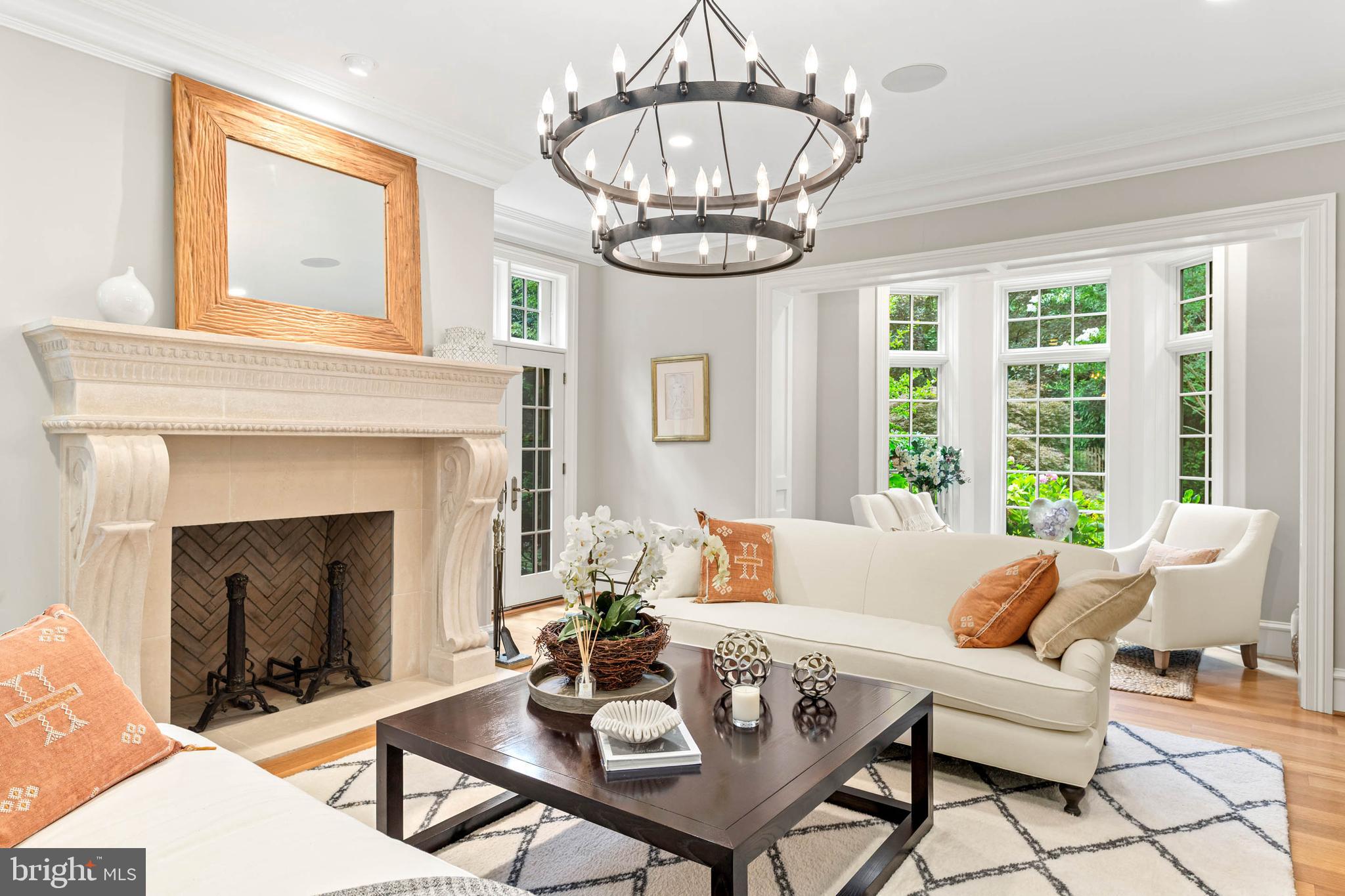 545 Avonwood Road Haverford, PA 19041 - Photo 15 of 86 a living room with furniture a fireplace and a chandelier