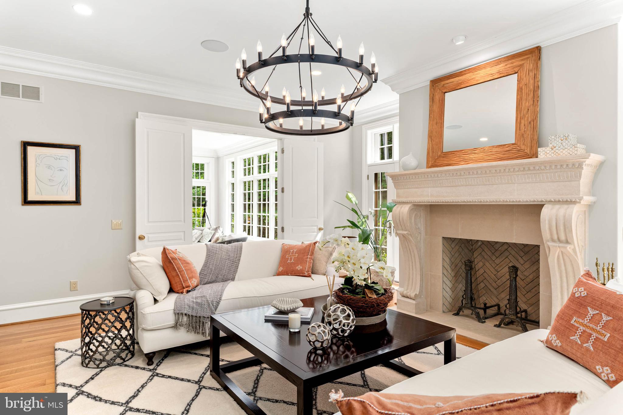 545 Avonwood Road Haverford, PA 19041 - Photo 17 of 86 a living room with furniture a chandelier and a fireplace