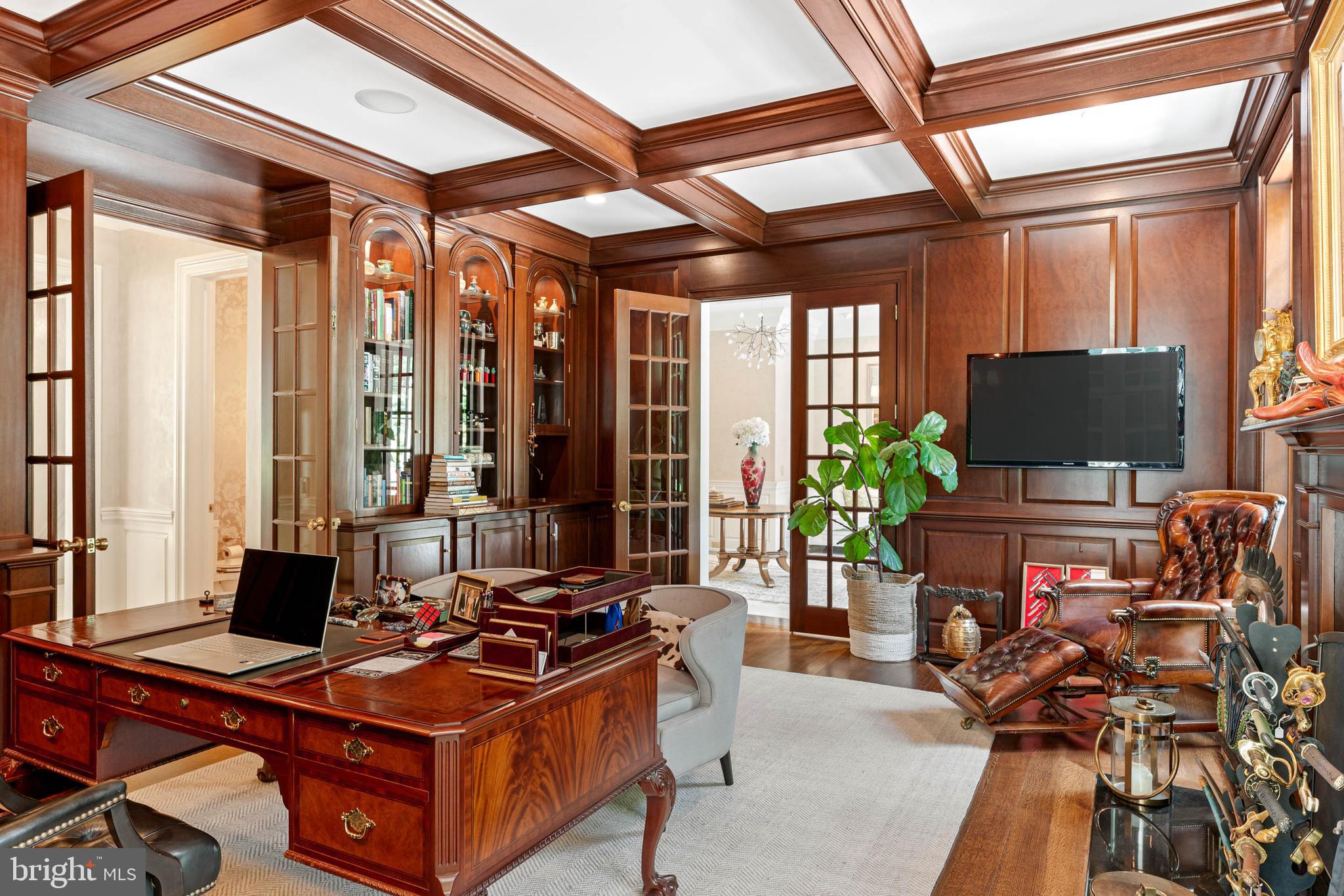 545 Avonwood Road Haverford, PA 19041 - Photo 22 of 86 a living room with furniture a flat screen tv and a floor to ceiling window