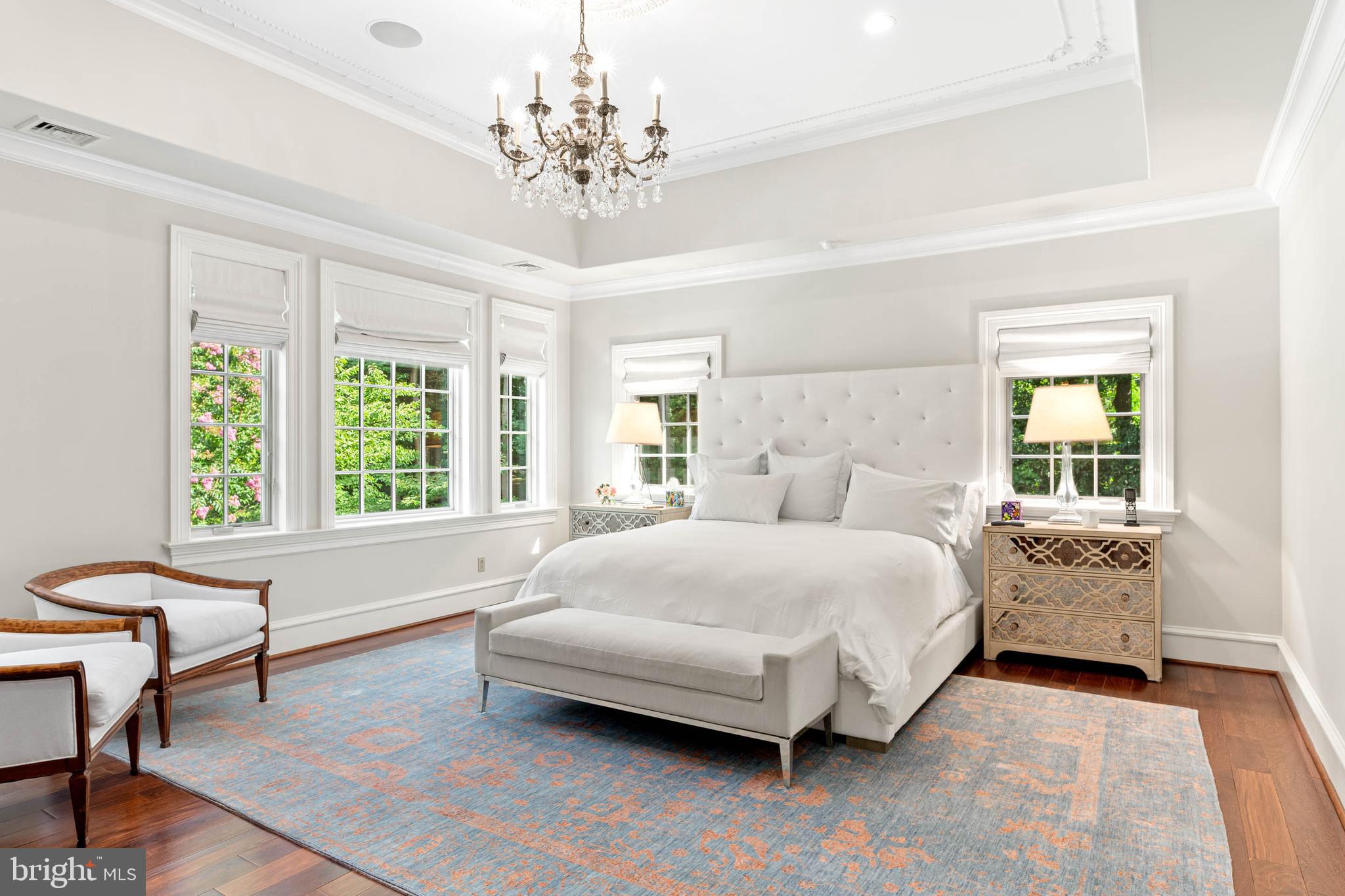 545 Avonwood Road Haverford, PA 19041 - Photo 41 of 86 a spacious bedroom with a bed and a chandelier