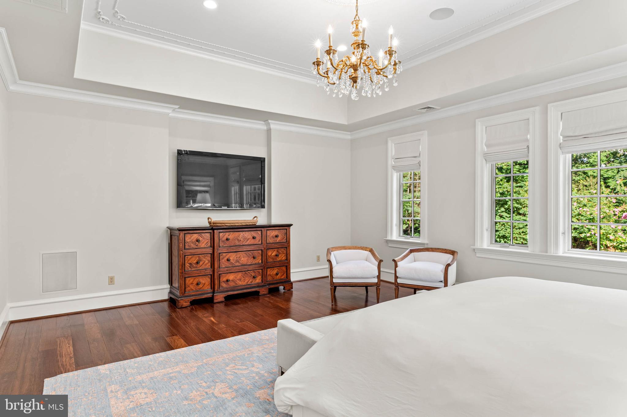 545 Avonwood Road Haverford, PA 19041 - Photo 42 of 86 a bedroom with a bed chairs and dresser with wooden floor