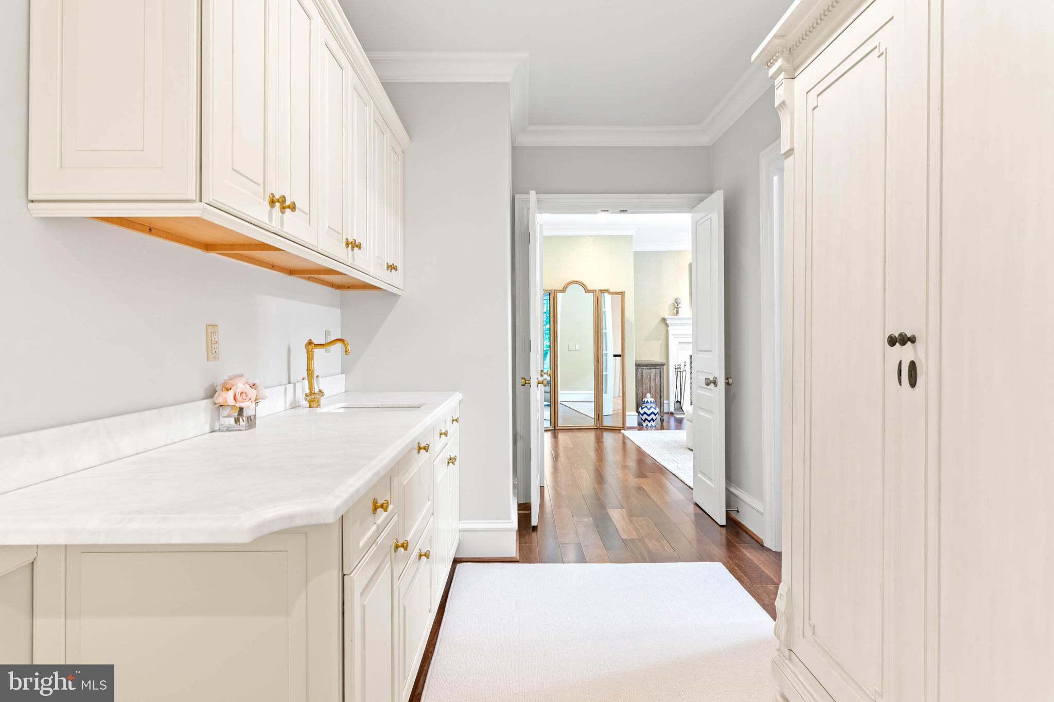 545 Avonwood Road Haverford, PA 19041 - Photo 43 of 86 a kitchen with a sink a stove cabinets and a wooden floor