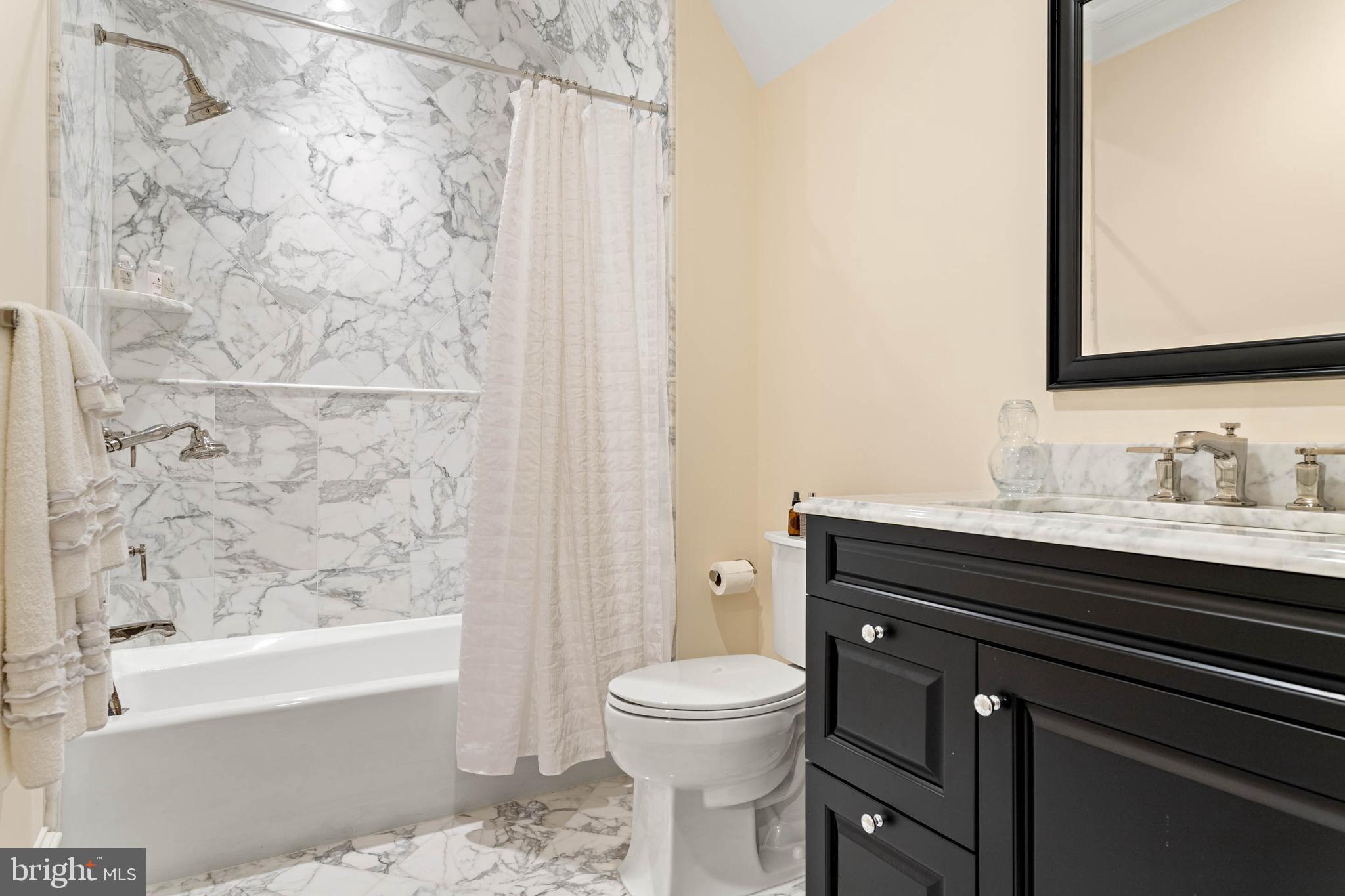 545 Avonwood Road Haverford, PA 19041 - Photo 58 of 86 a bathroom with a granite countertop sink toilet a mirror and bathtub