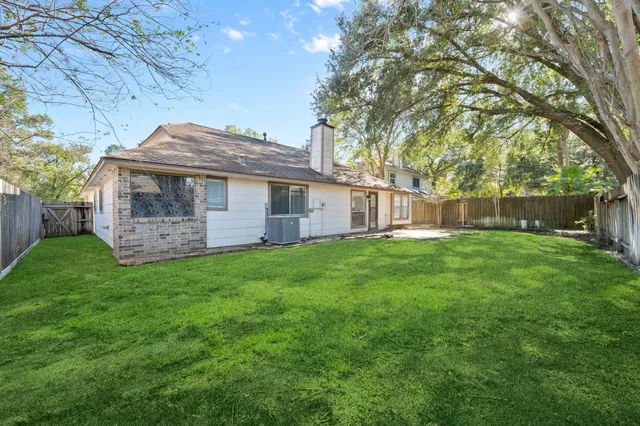 a view of a house with a backyard