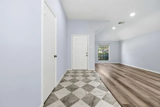 a view of an empty room and window