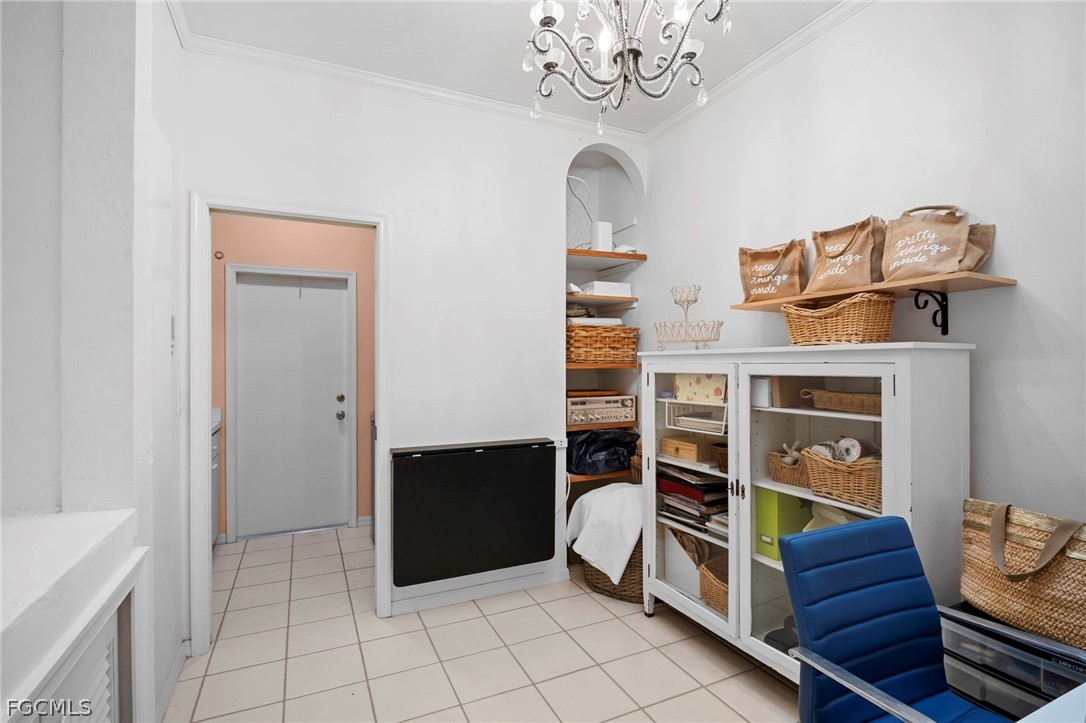 11772 Mahogany Run Fort Myers, FL 33913 - Photo 28 of 50 a room with fireplace cabinets and a window