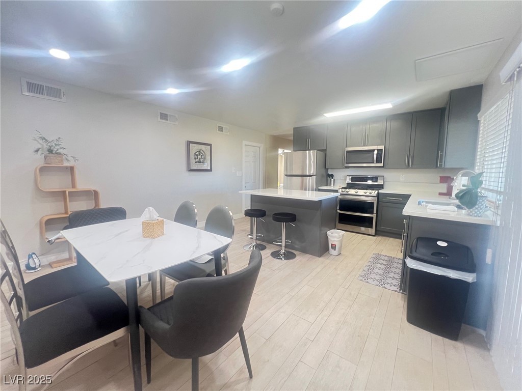 4194 Greenpoint Street Las Vegas, NV 89147 - Photo 12 of 25 Dining space with light wood-style flooring
