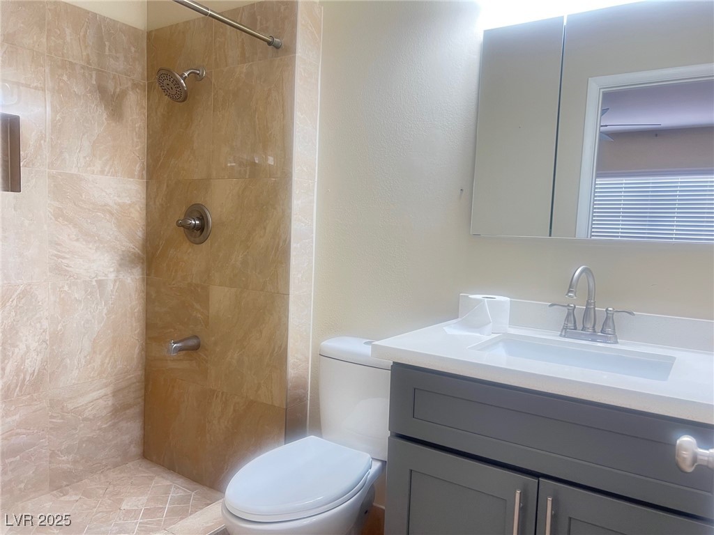 4194 Greenpoint Street Las Vegas, NV 89147 - Photo 15 of 25 Bathroom with vanity and a shower stall