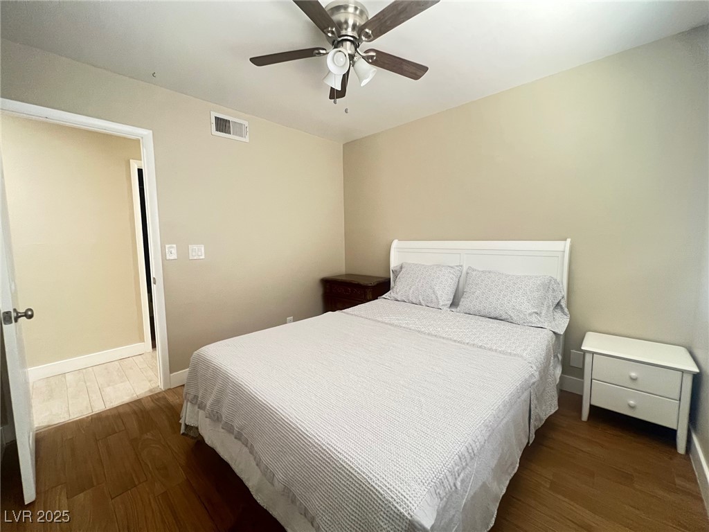 4194 Greenpoint Street Las Vegas, NV 89147 - Photo 20 of 25 Bedroom with dark wood finished floors and ceiling fan