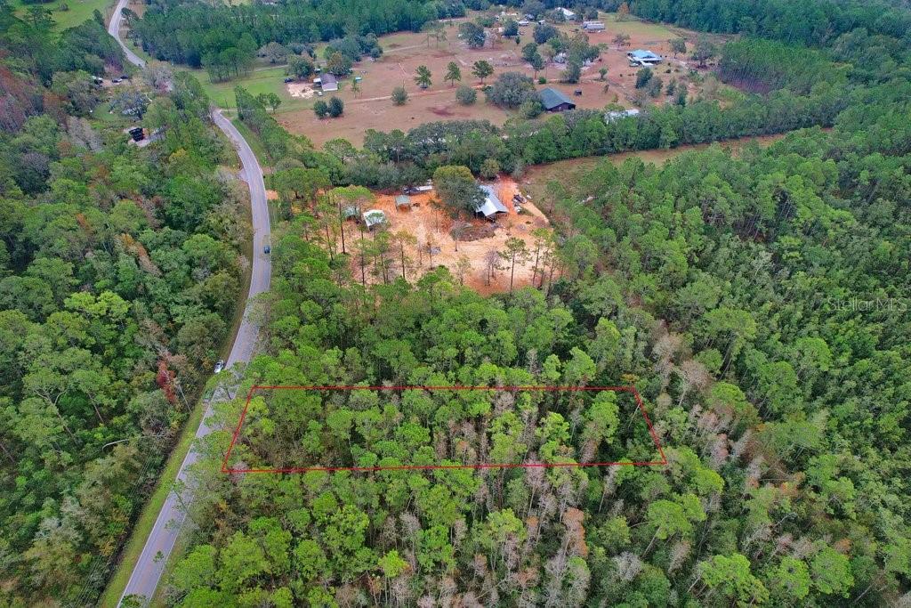 Poyner Road Polk City, FL 33868 - Photo 4 of 10 an aerial view of residential houses with outdoor space and trees