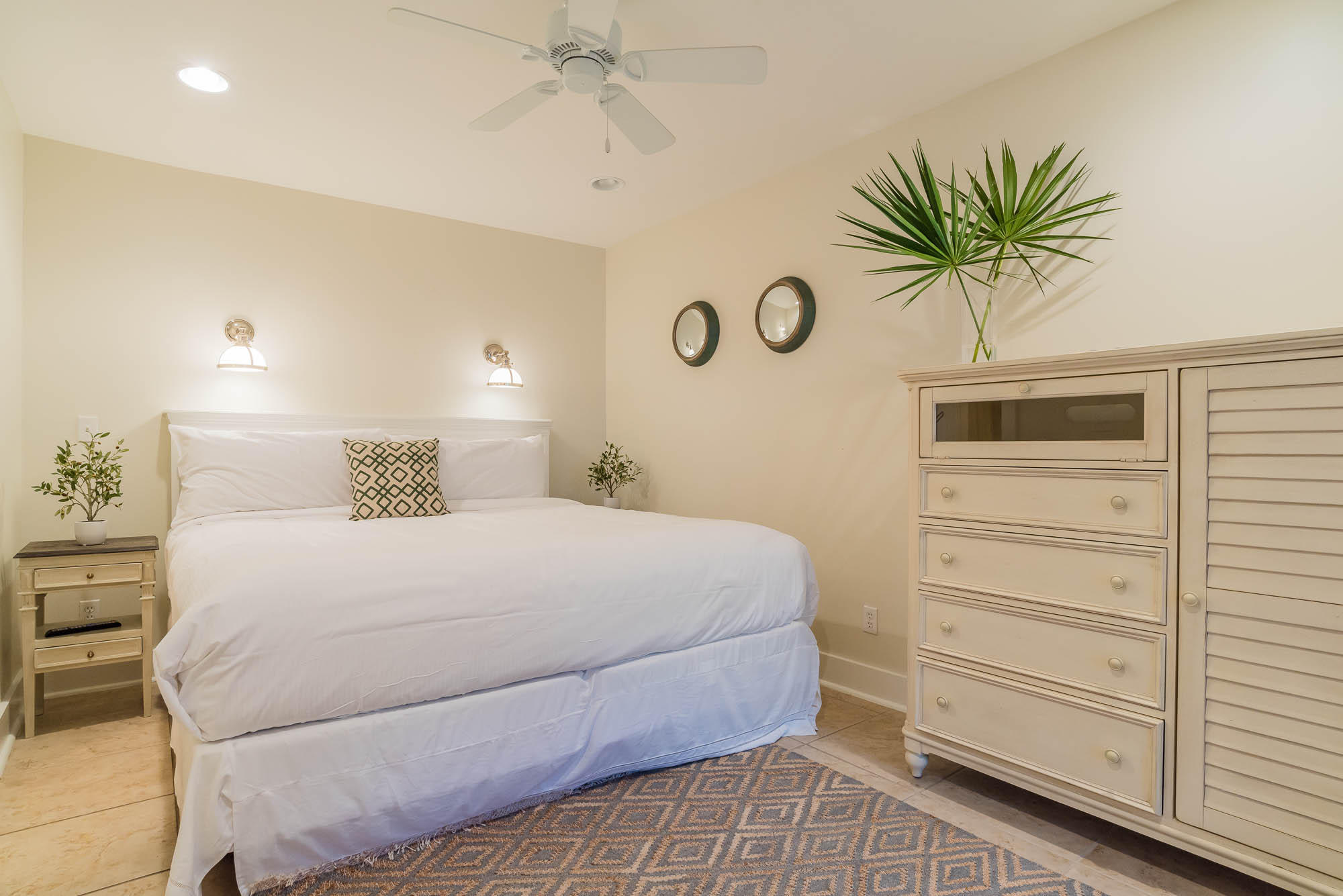 179 Pelican Circle Seacrest, FL 32461 - Photo 21 of 87 a bedroom with a bed and a chandelier