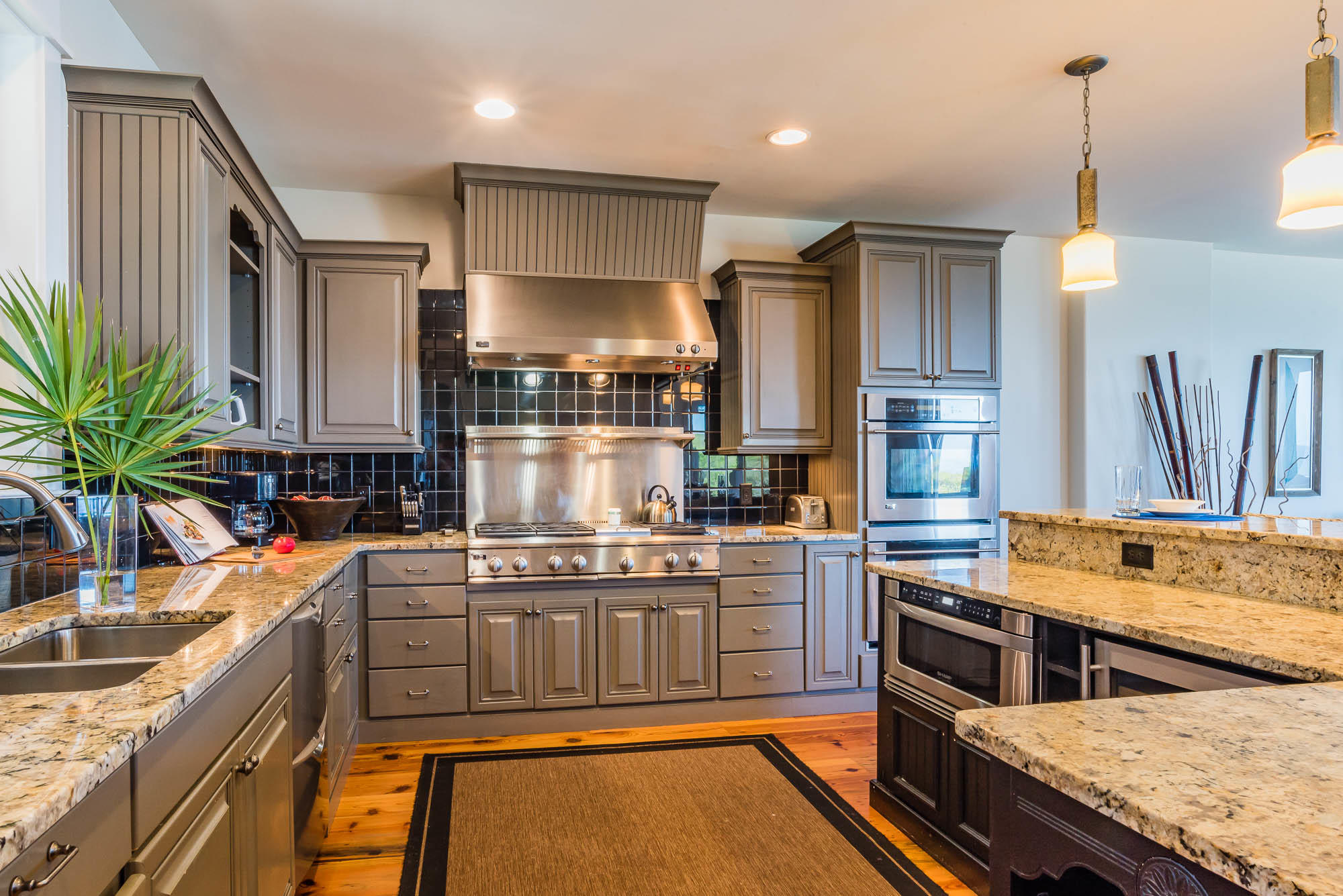179 Pelican Circle Seacrest, FL 32461 - Photo 27 of 87 a kitchen with stainless steel appliances granite countertop a stove a sink and a refrigerator