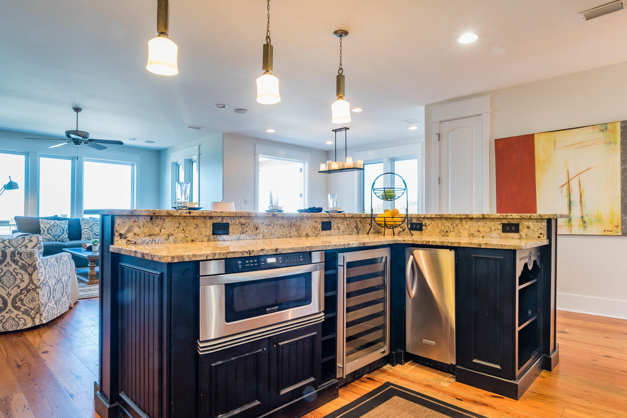 179 Pelican Circle Seacrest, FL 32461 - Photo 28 of 87 a open kitchen with stainless steel appliances granite countertop a stove and a wooden floors