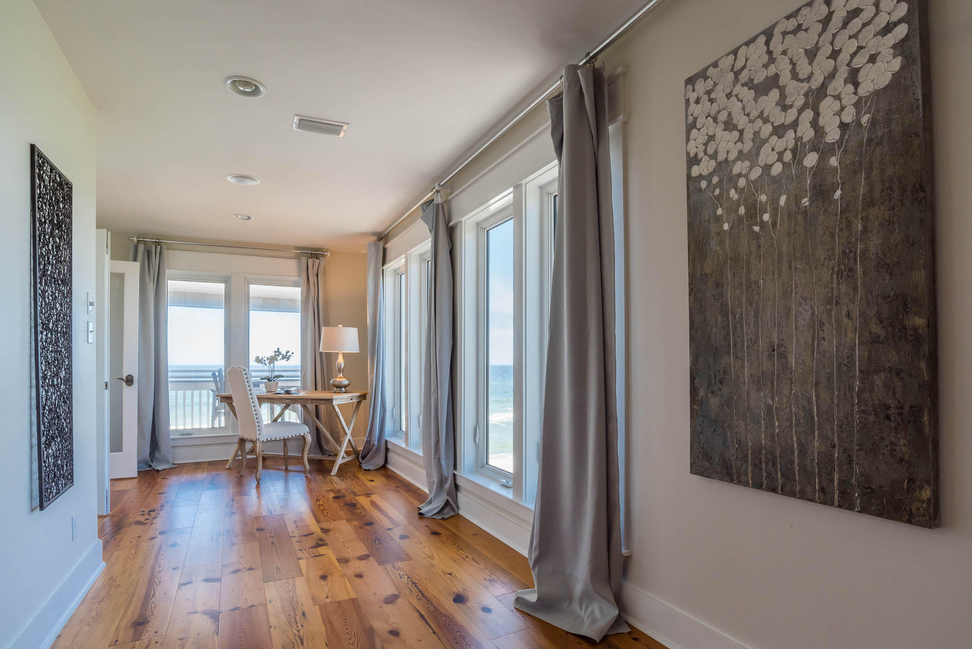179 Pelican Circle Seacrest, FL 32461 - Photo 40 of 87 a view of a hallway with wooden floor and furniture