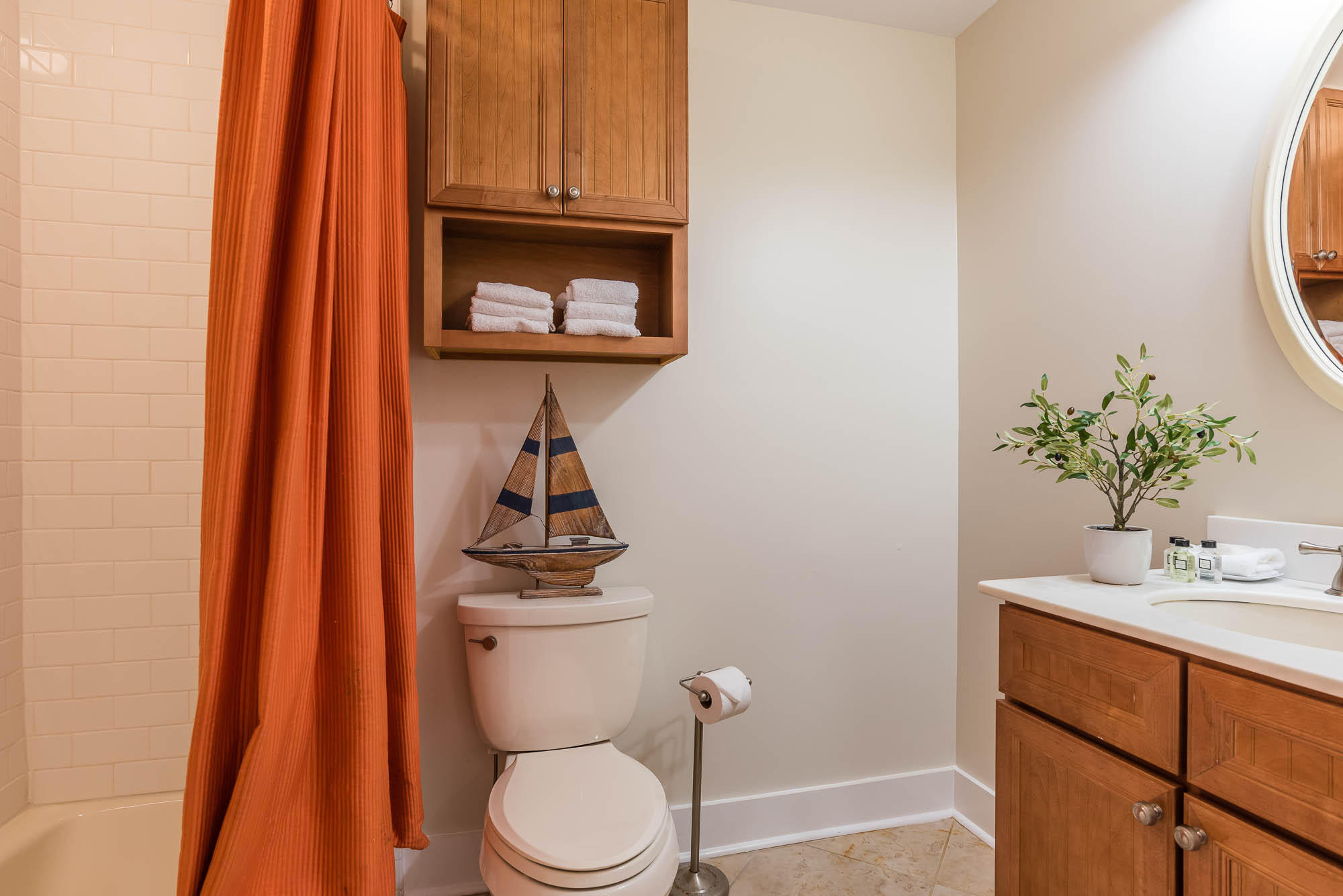 179 Pelican Circle Seacrest, FL 32461 - Photo 54 of 87 a bathroom with a toilet a sink and a mirror