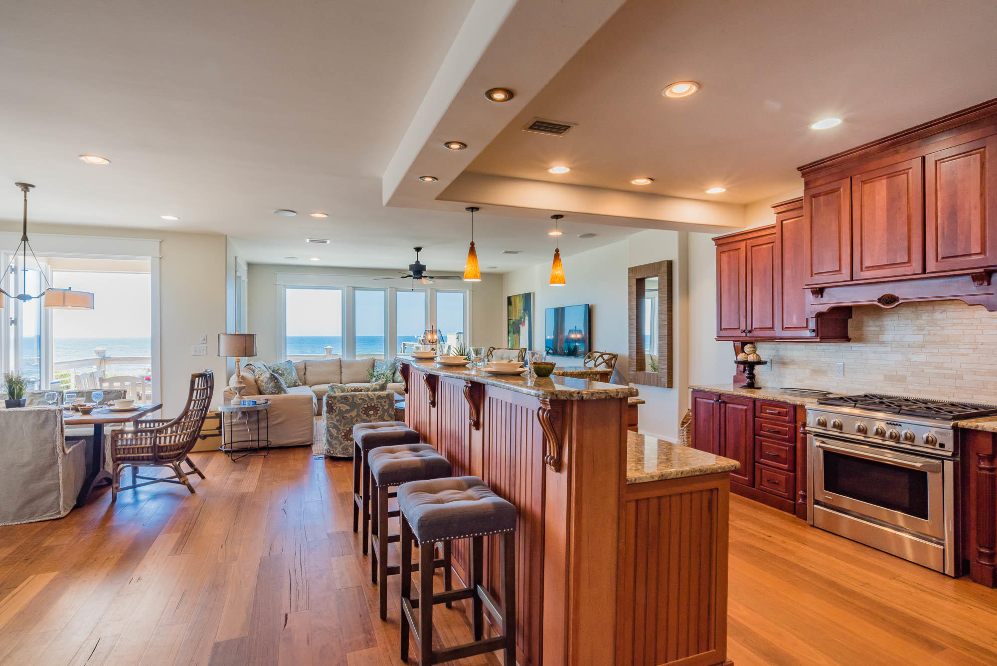 179 Pelican Circle Seacrest, FL 32461 - Photo 57 of 87 a open kitchen with stainless steel appliances granite countertop a stove and a refrigerator