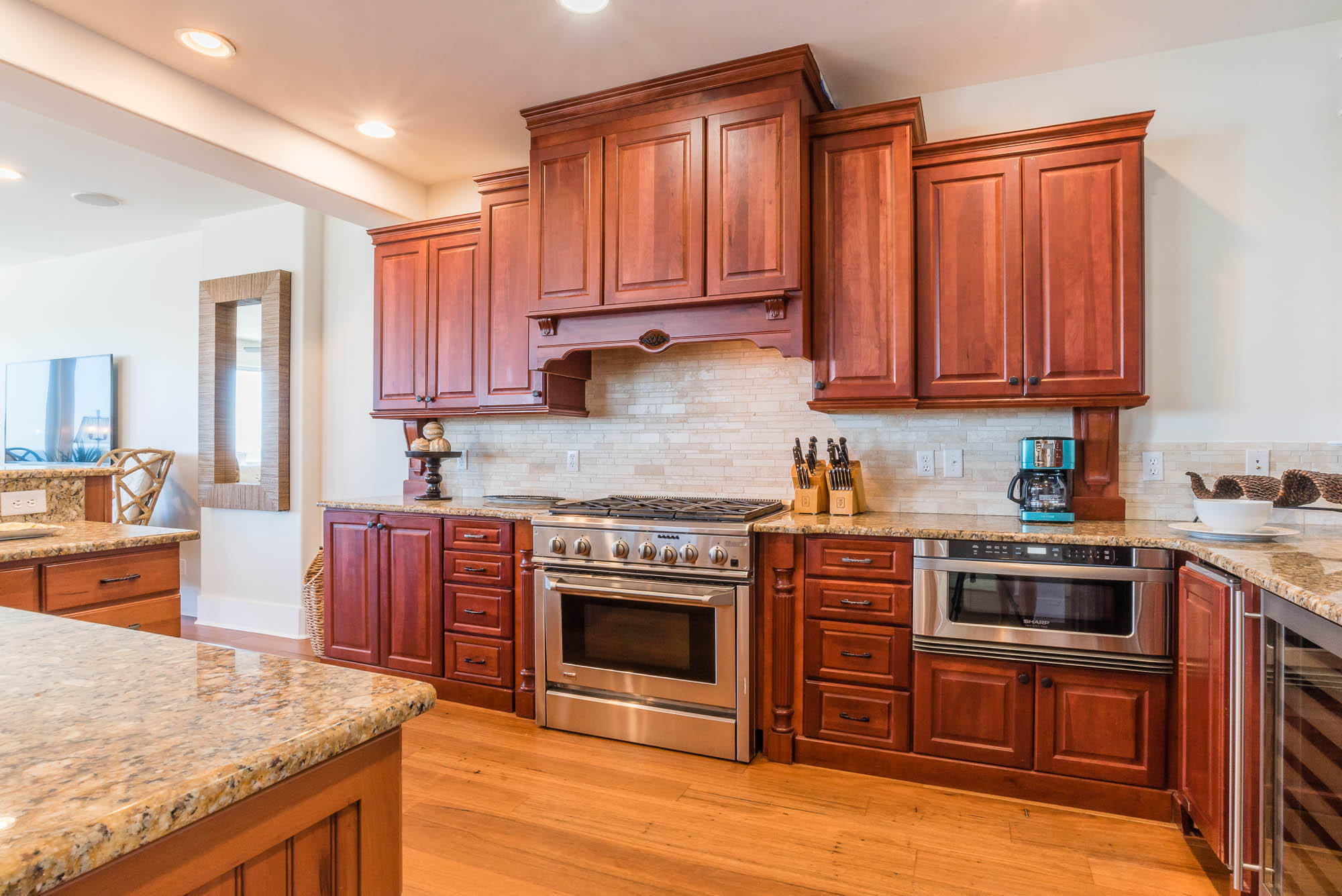 179 Pelican Circle Seacrest, FL 32461 - Photo 59 of 87 a kitchen with stainless steel appliances granite countertop a stove top oven