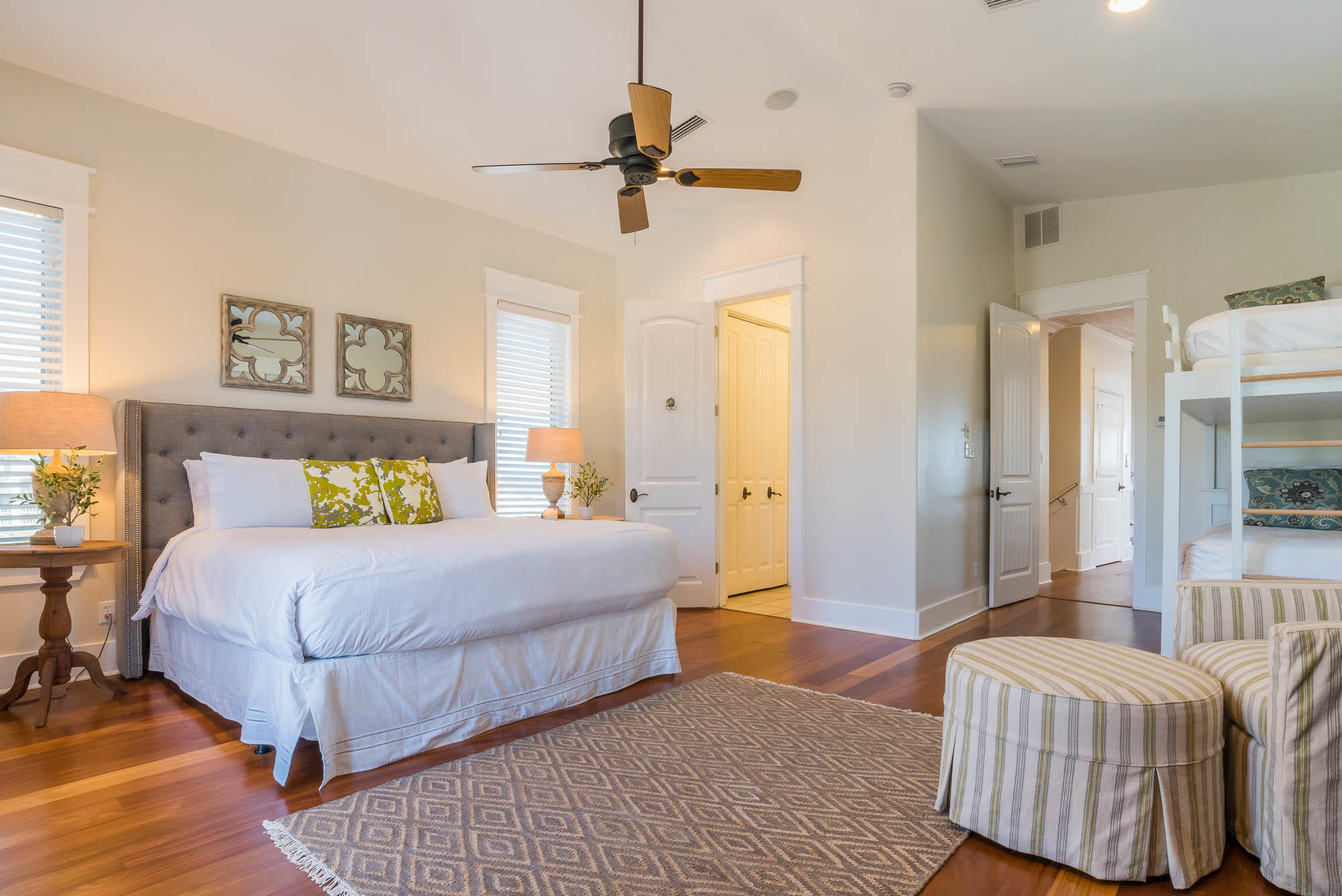 179 Pelican Circle Seacrest, FL 32461 - Photo 64 of 87 a bedroom with a bed and a chandelier