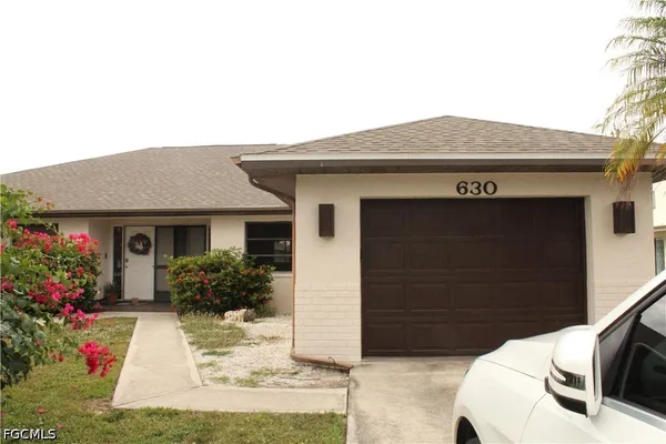 a view of house with yard