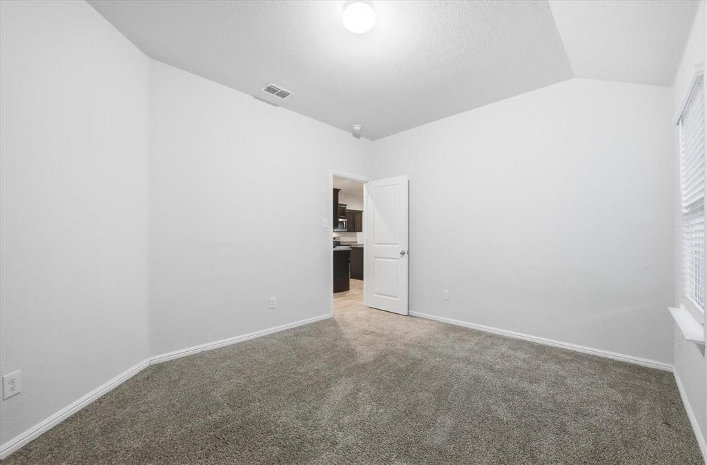 9308 Desertrock Road Fort Worth, TX 76131 - Photo 22 of 29 a view of an empty room