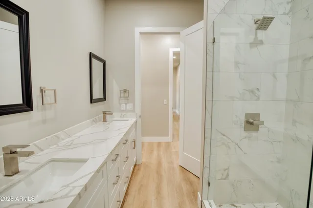 a view of hallway with wooden floor