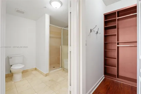 a bathroom with a toilet and a bathtub
