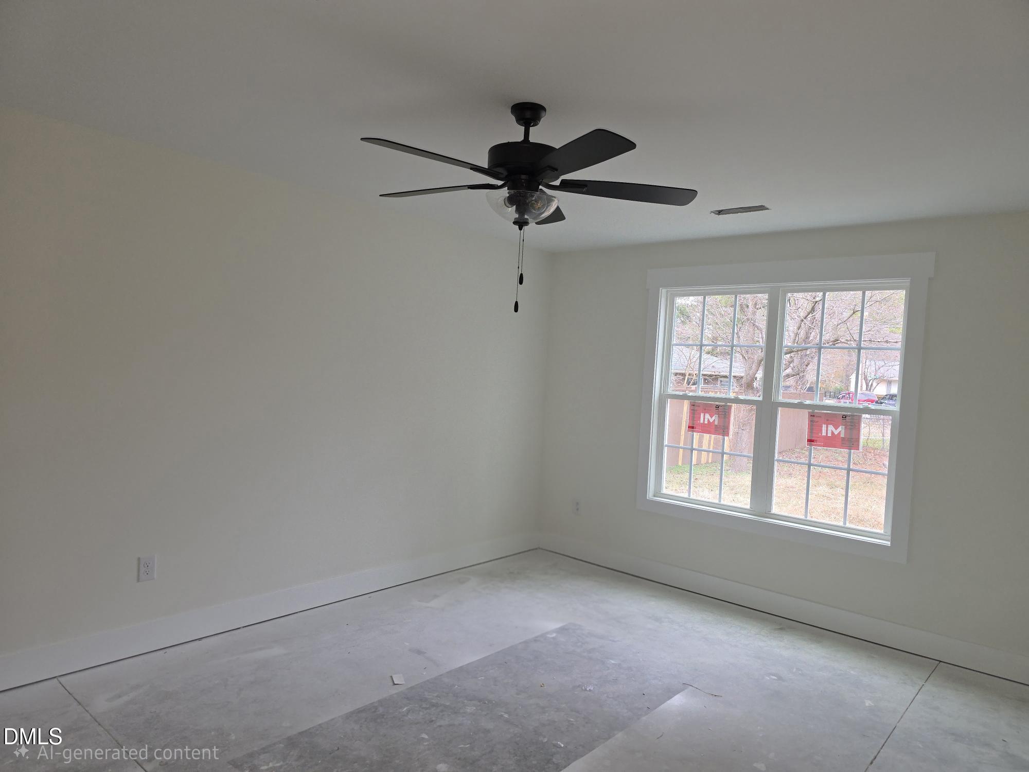 307 East Holmes Street Benson, NC 27504 - Photo 13 of 15 an empty room with a window