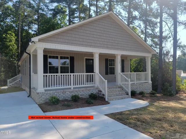 a picture of a bathroom with a shower curtain