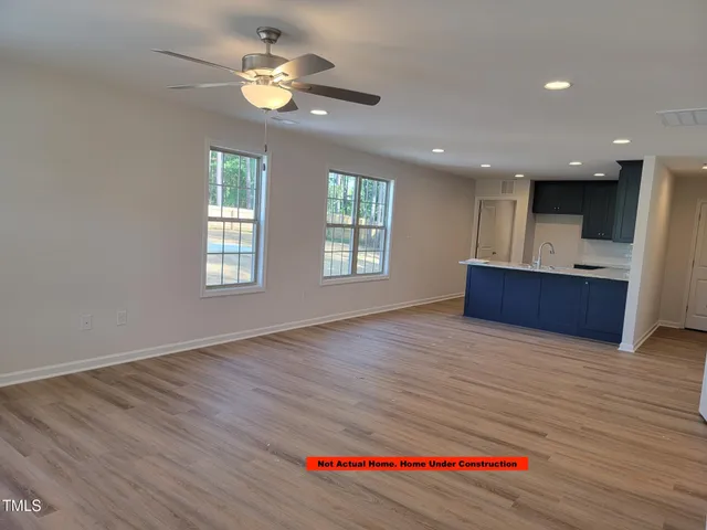 a view of pool house with swimming pool in front of it