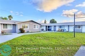 7421 Venetian Street, Unit 2 Miramar, FL 33023 - Photo 12 of 12 a view of a house with a yard