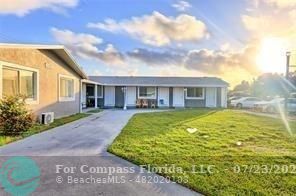 7421 Venetian Street, Unit 2 Miramar, FL 33023 - Photo 2 of 12 a view of a house with a backyard