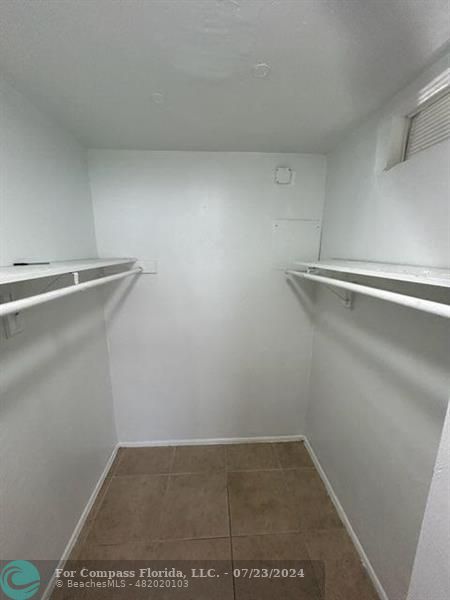 7421 Venetian Street, Unit 2 Miramar, FL 33023 - Photo 10 of 12 a view of a room with racks on the wall