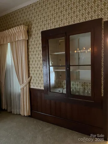 a bedroom with bed and window