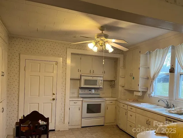 a view of a utility room with closet