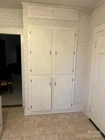 a view of a hallway with seating area