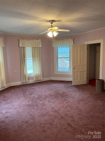 a bedroom with a bed and flat screen tv