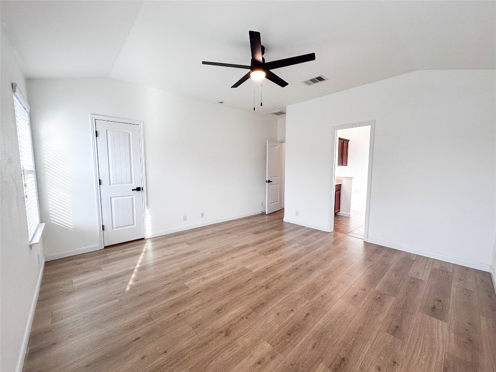 1437 April Meadows Loop Georgetown, TX 78626 - Photo 13 of 27 wooden floor in an empty room