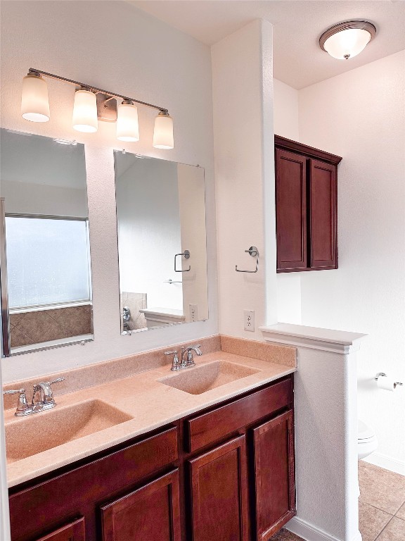 1437 April Meadows Loop Georgetown, TX 78626 - Photo 16 of 27 a bathroom with a sink and a mirror