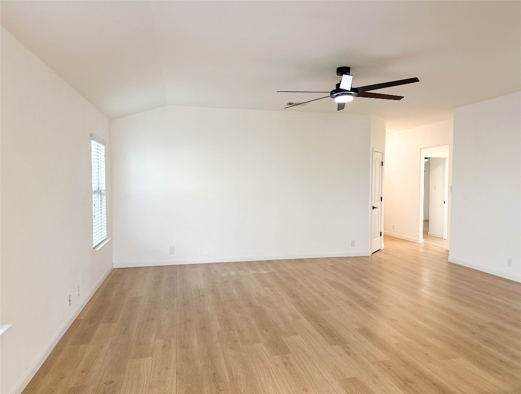 1437 April Meadows Loop Georgetown, TX 78626 - Photo 5 of 27 a view of a room with wooden floor closet and windows