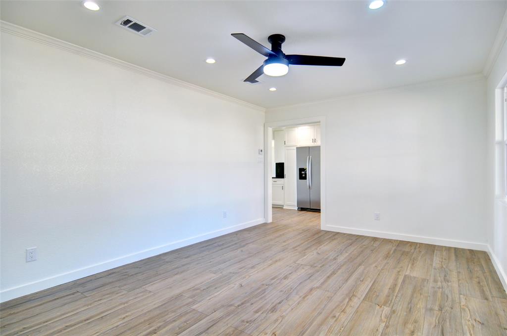 5549 Sam Calloway Road Fort Worth, TX 76114 - Photo 6 of 31 an empty room with wooden floor and a ceiling fan